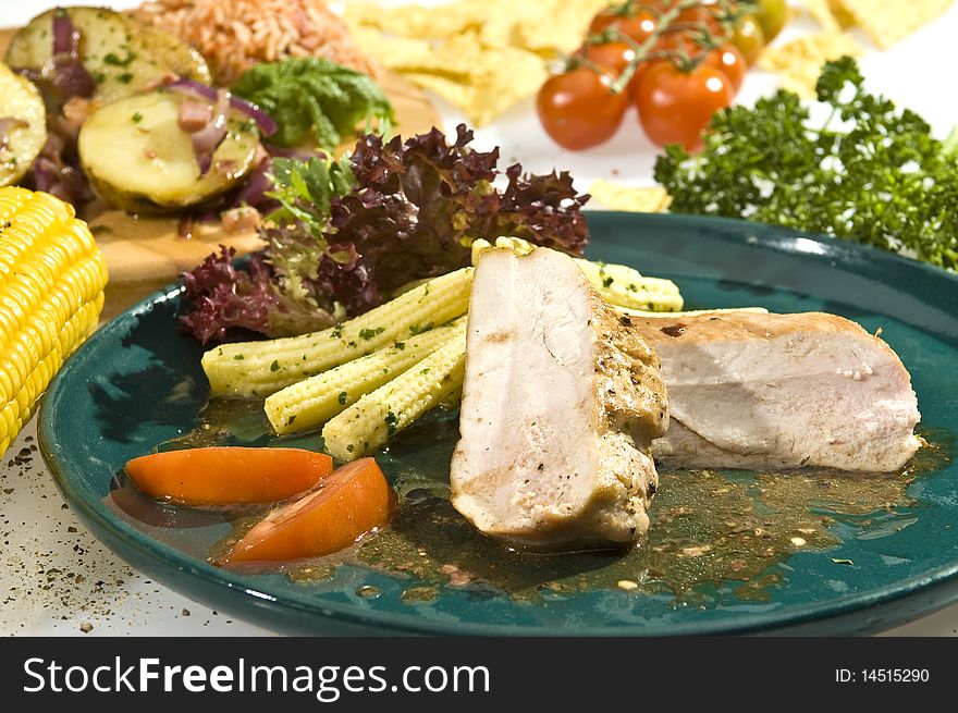 Baked tenderloin with baby corn, lettuce and tomato. Baked tenderloin with baby corn, lettuce and tomato