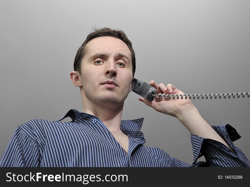 Young man talking by phone