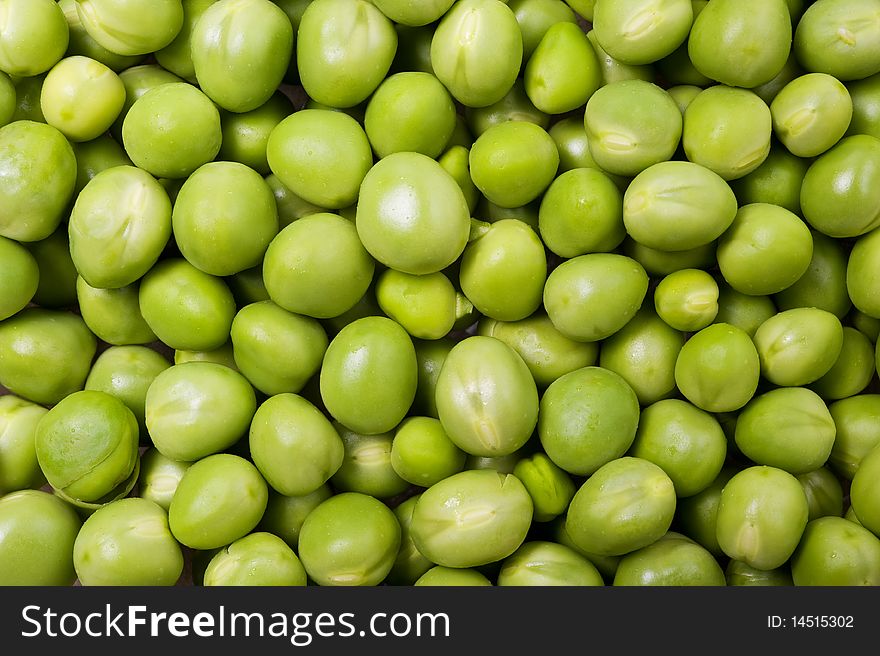 Background of fresh green peas. Close up shot.