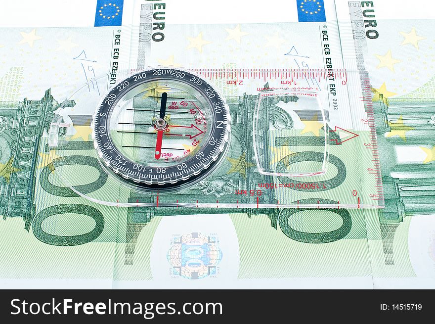 Currency euro and compass,Ñlose up. Currency euro and compass,Ñlose up