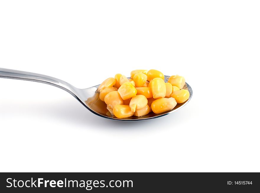 Spoon with a heaping serving of fresh yellow cut corn. Spoon with a heaping serving of fresh yellow cut corn