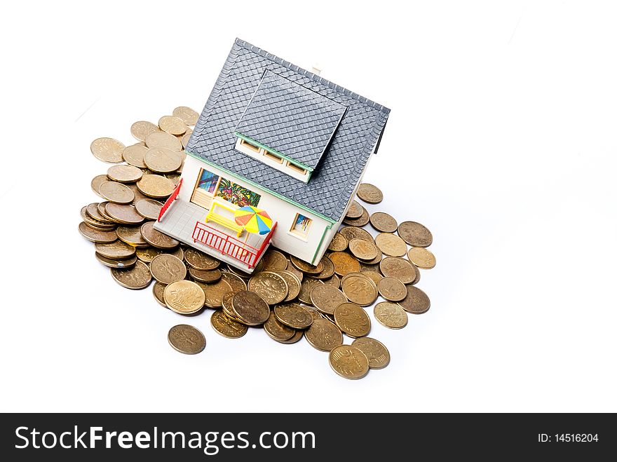 House on pile of coins. House on pile of coins