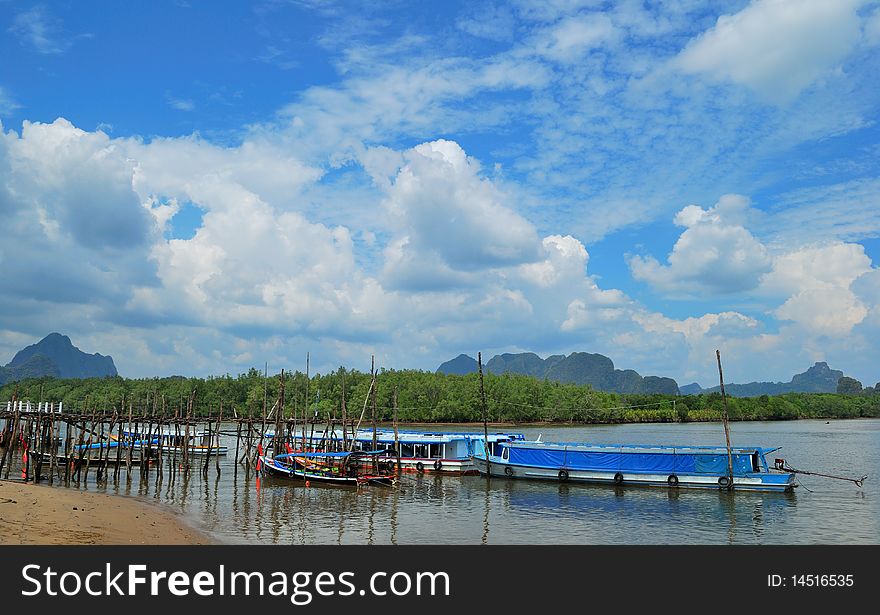 Longtail boat and nice sky taken from phang-nga thailand