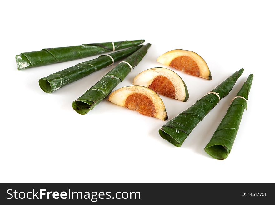 Areca nut, betel nut chewed with the leaf is mild stimulant