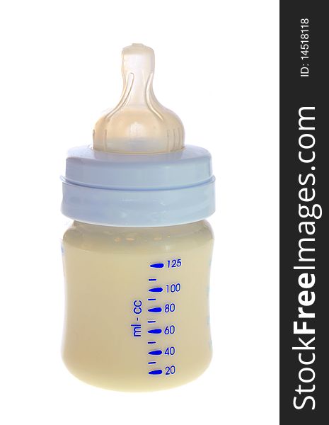 Children's small bottle with milk, on a white background it is isolated. Children's small bottle with milk, on a white background it is isolated.