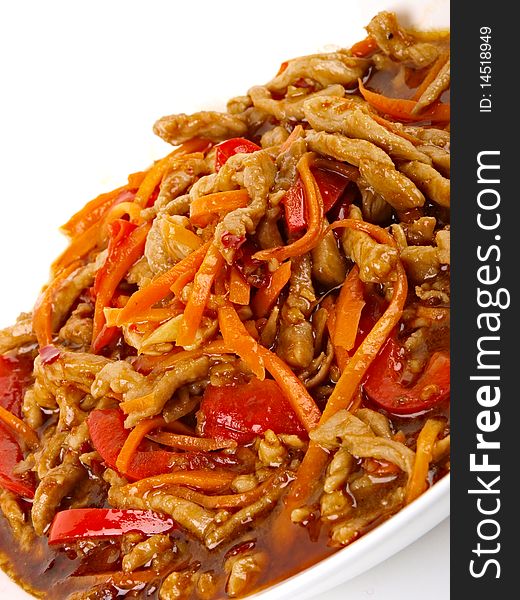 Chinese fried pork meat with pepper and carrot