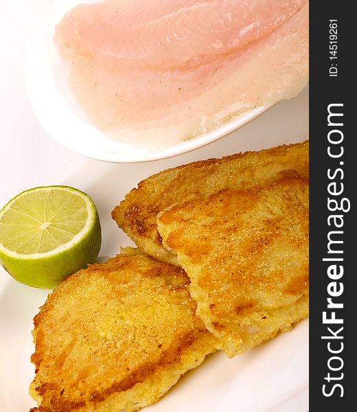 Fish Filet with lemon. Close up on white background