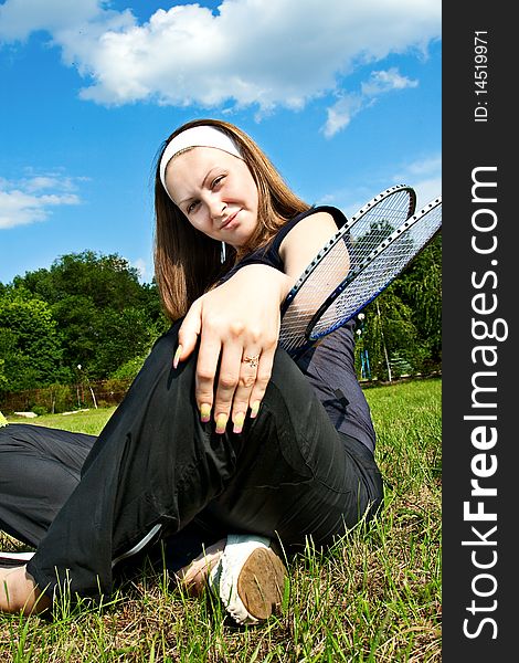 Tennis player with rackets outdoor