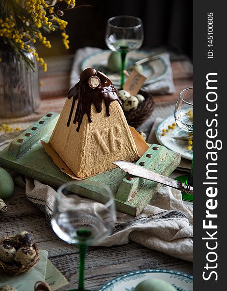 Orthodox Easter Table Setting With Caramel Easter Cottage Cheese Cake On Wooden Light Green Board On Grey Wooden Table