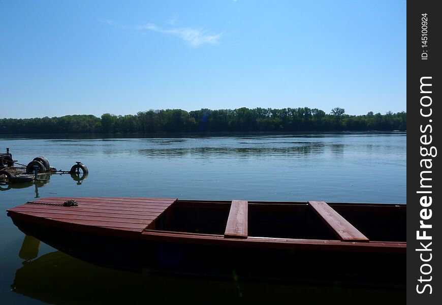 Small Red Fishing Boat On The Danube River. Detail.