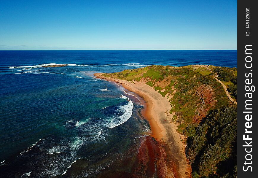 Aerial view of Long Reef Headland Sydney NSW Australia. Tide pools on the Tasman sea during low tide at Northern beaches of Sydney.