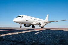 White Passenger Jet Plane On The Airport Apron Royalty Free Stock Photography