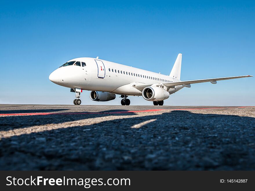 White Passenger Jet Plane On The Airport Apron