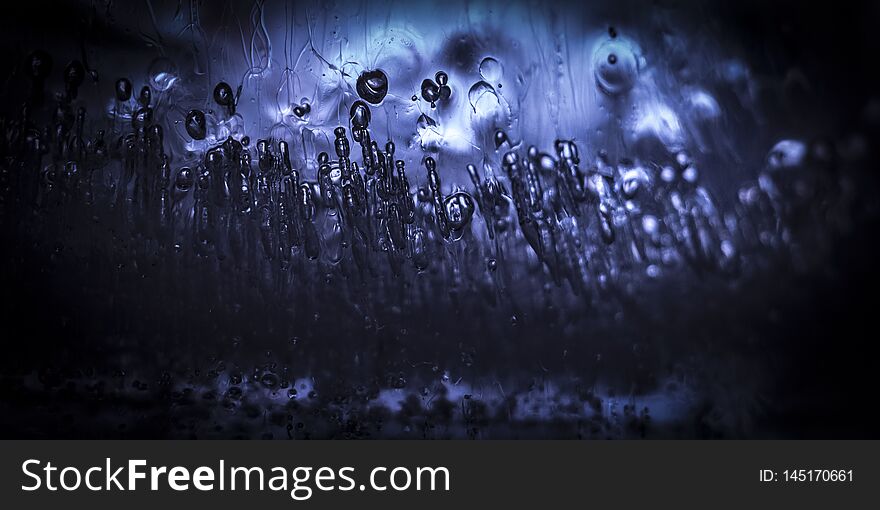 Bubbles of air frozen inside the ice close up