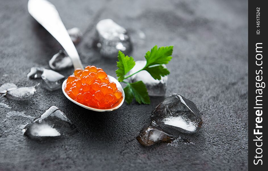 Spoon with delicious red caviars