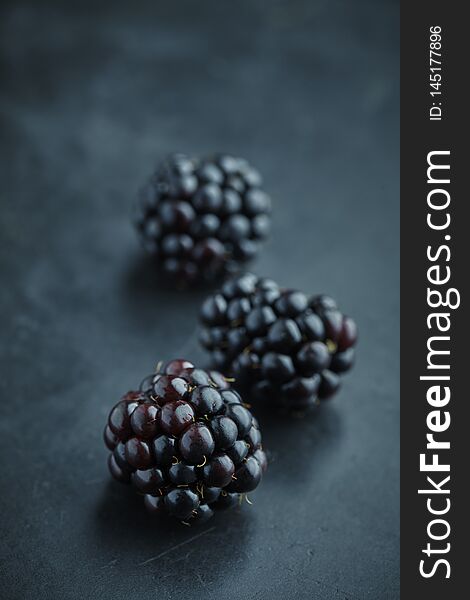 Closeup of fresh blackberries on a dark background. Closeup of fresh blackberries on a dark background