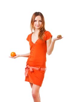 Young Pretty Girl In Dress With Orange And Kiwi Stock Photography Young Pretty Girl In Dress With Orange And Kiwi Stock Photography