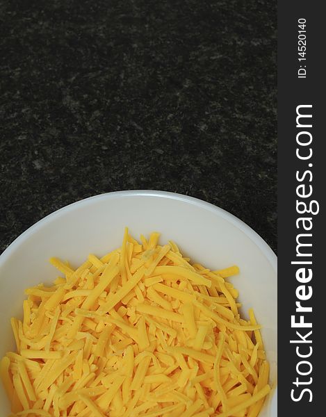Yellow Cheddar Cheese In Bowl