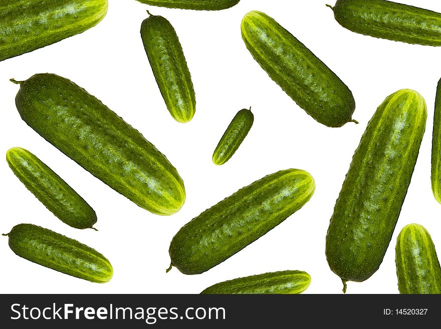 Ripe juicy cucumbers on a white background