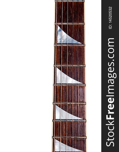An electric guitar neck with shark inlays