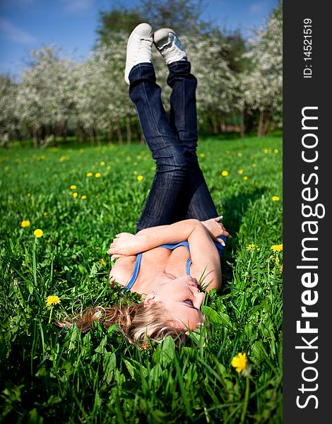 Young model Lying in the dandelion field. Young model Lying in the dandelion field