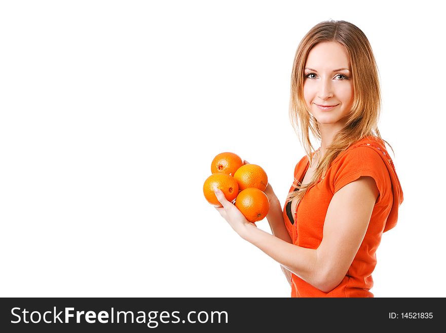 Young Pretty Girl In Dress With Oranges