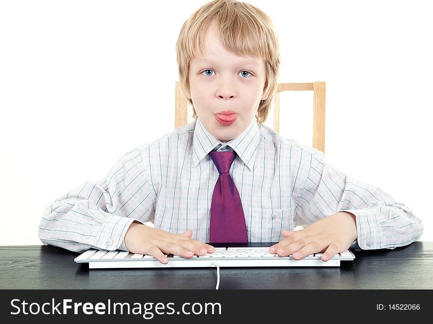 Boy with keyboard isolated on white