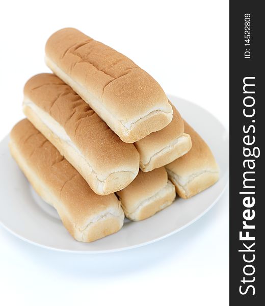 Plain hotdog buns isolated against a white background