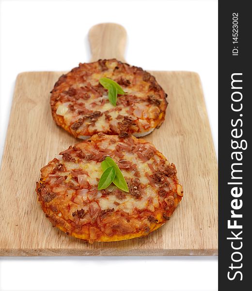 Mini Pizzas isolated on a kitchen bench