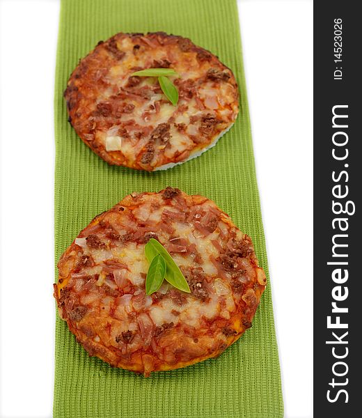 Mini Pizzas isolated on a kitchen bench