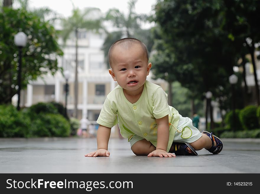 It is a cute chinese baby, he is crying in the outdoor. It is a cute chinese baby, he is crying in the outdoor.