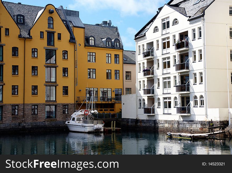 Boat In A River Near Buildings