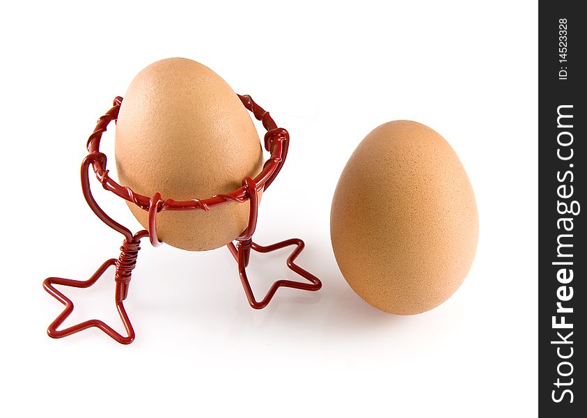 Eggs and a red chicken shape egg Cup. Eggs and a red chicken shape egg Cup