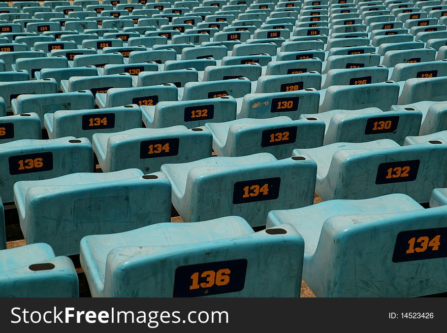 Stadium seats in a sports view showing seat number. Stadium seats in a sports view showing seat number