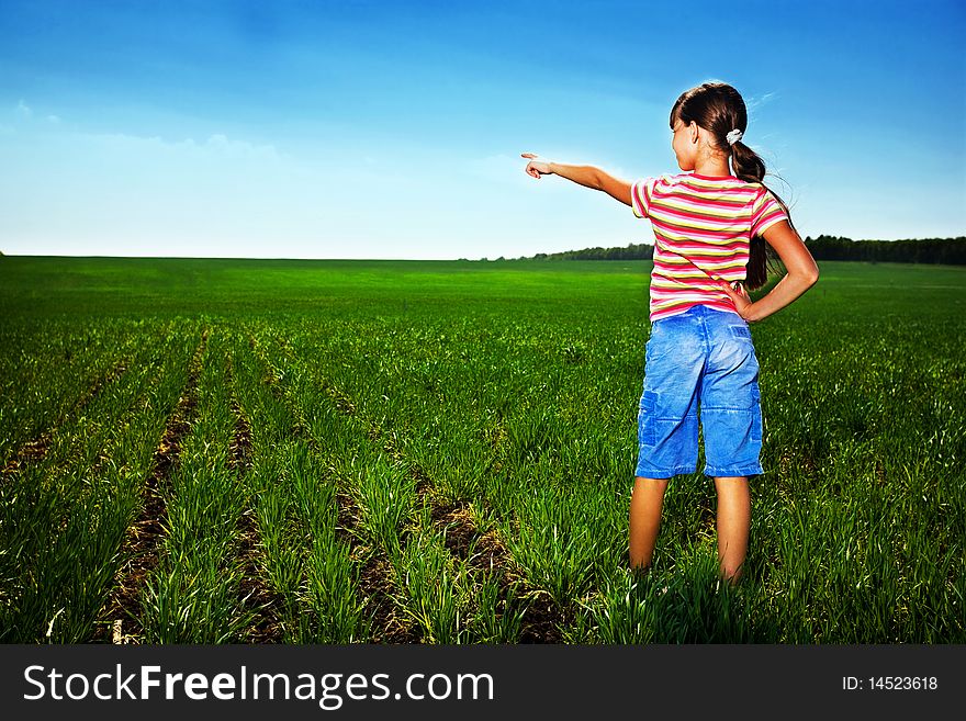Small girl in green field. Small girl in green field