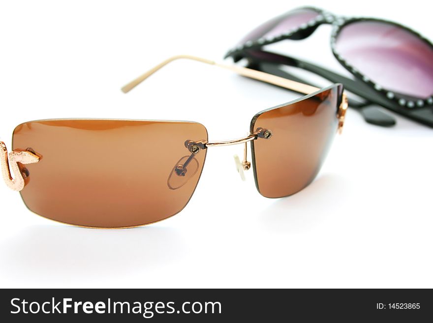 Two sunglasses isolated on white background.