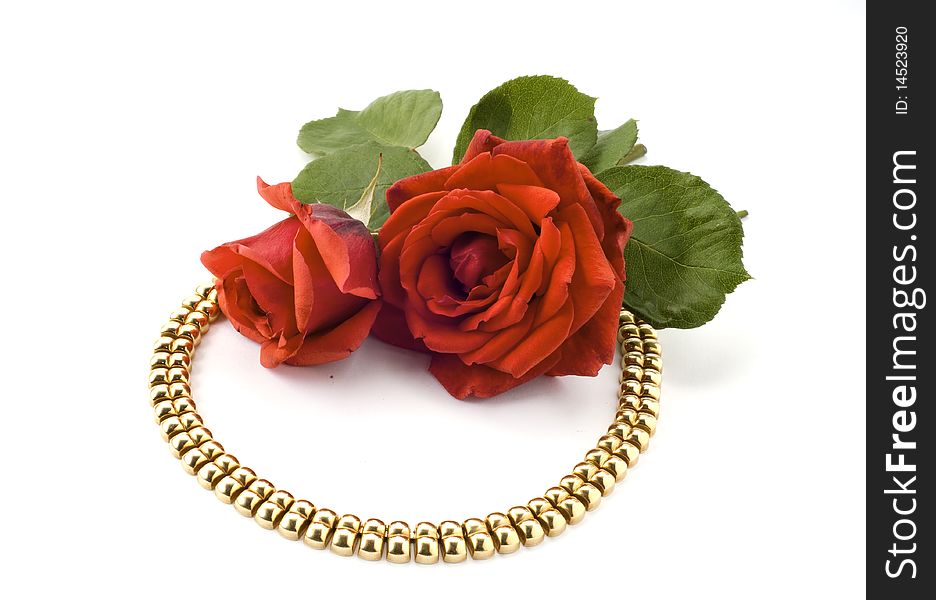 Necklace and red rose on white background. Necklace and red rose on white background