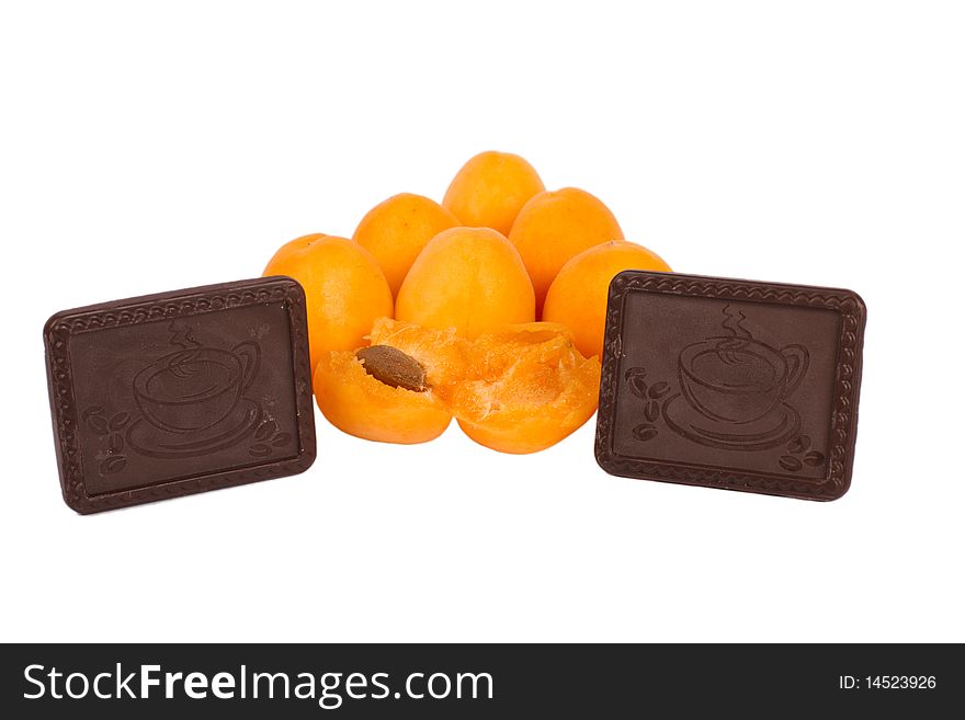 Frash apricots with chokolate cookies isolated on white