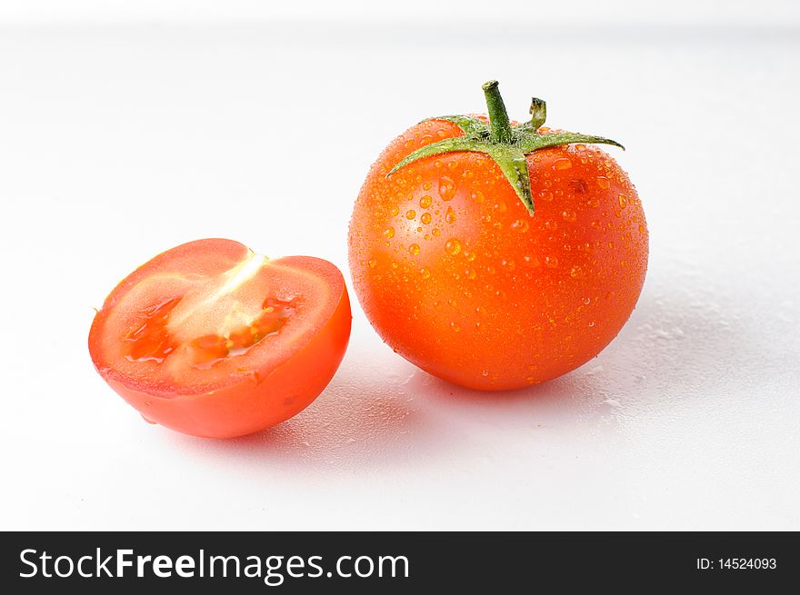 Fresh ripe tomato on a white background