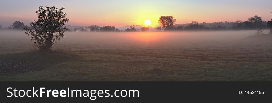 Sunrise over the misty valley. Sunrise over the misty valley