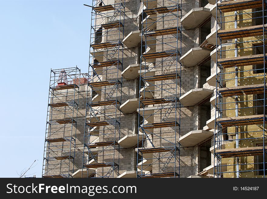 Multi-storey building under construction from concrete and metal