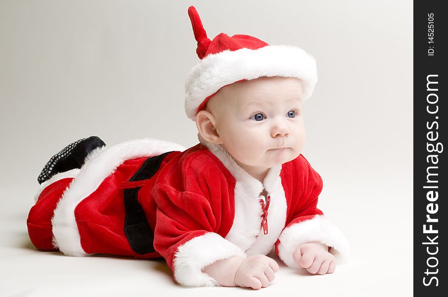 Little baby as Santa Claus