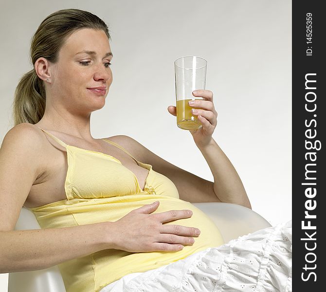 Pregnant woman  with a glass of juice