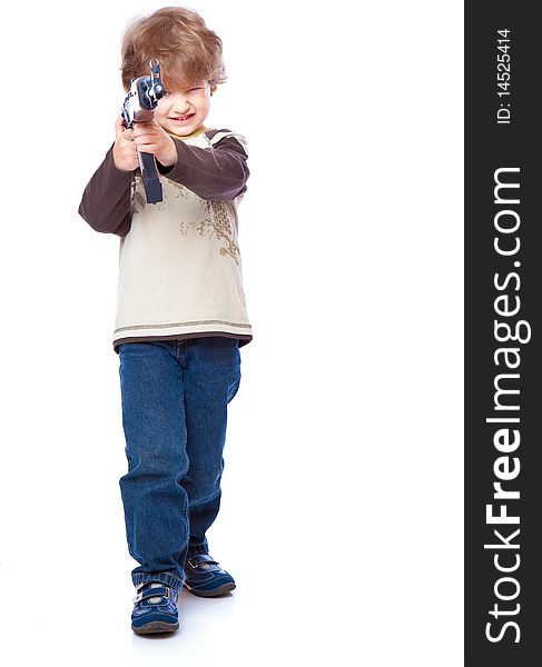 Portrait of little boy with automatic weapon