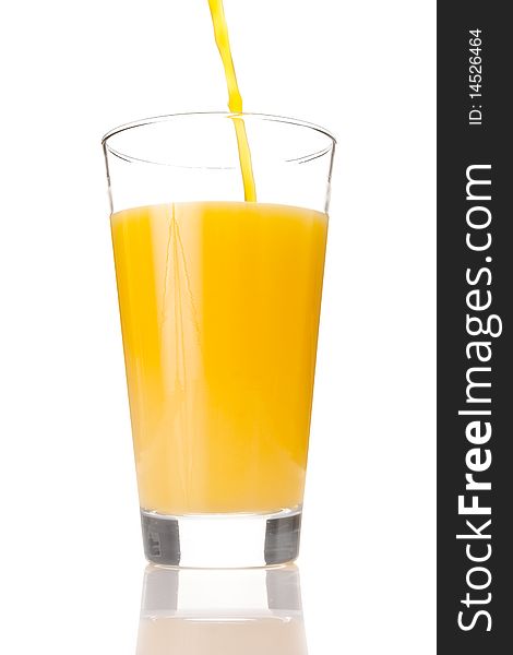 Juice in a glass isolated on white. Juice in a glass isolated on white
