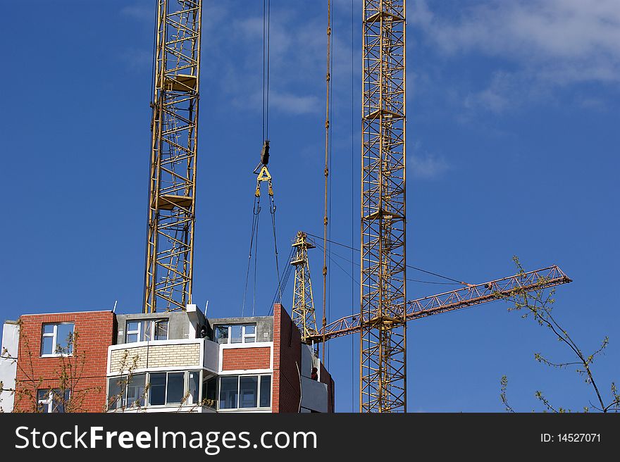 Elevating Construction Crane Against The Blue Sky