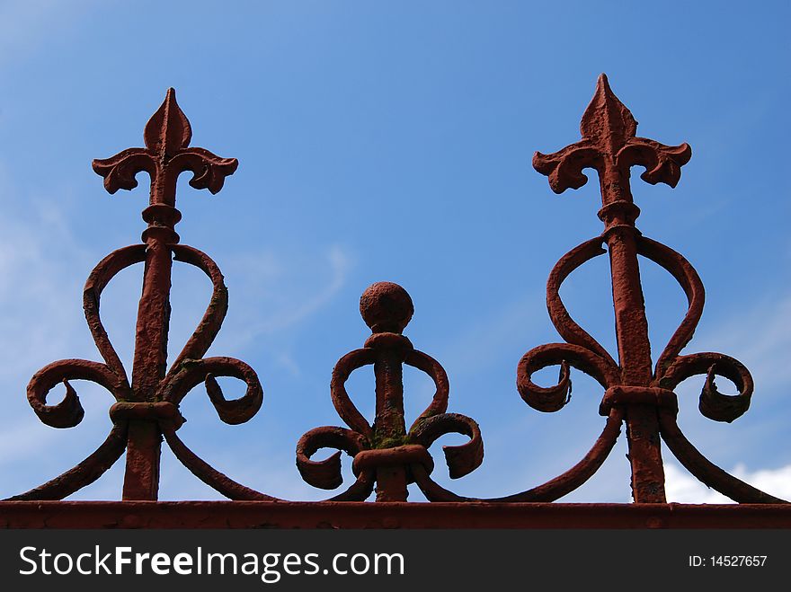 Old gate detail on the blue sky