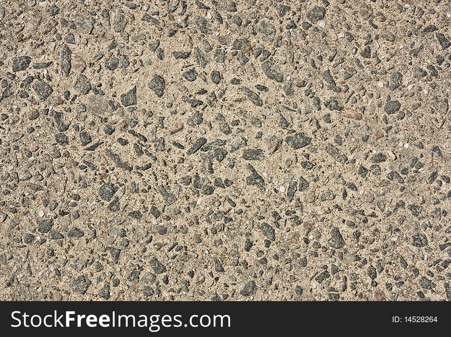 Old asphalt with stones close-up as background. Old asphalt with stones close-up as background