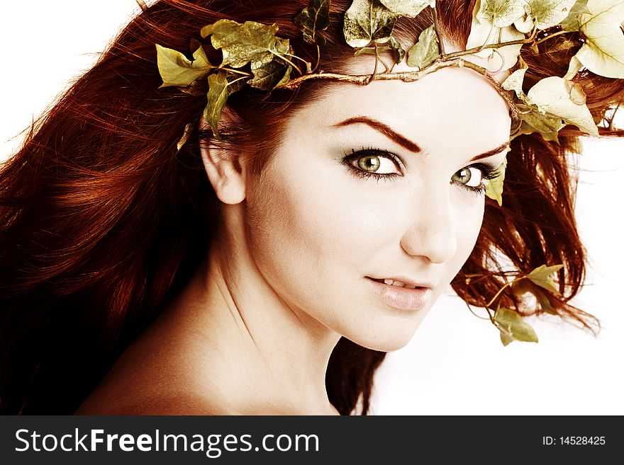 A beautiful young woman with flowers in her hair. A beautiful young woman with flowers in her hair.