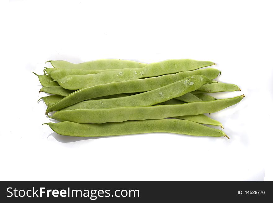 Bunch of green beans on white background.